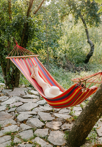 woman relaxing in hammock