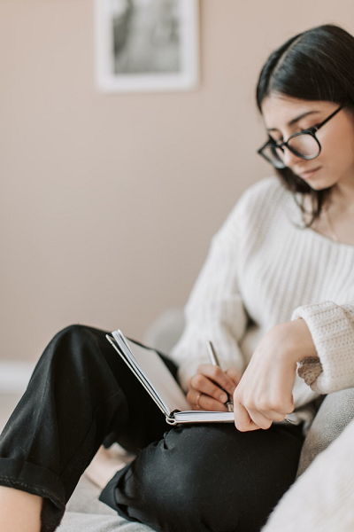 woman writing in journal