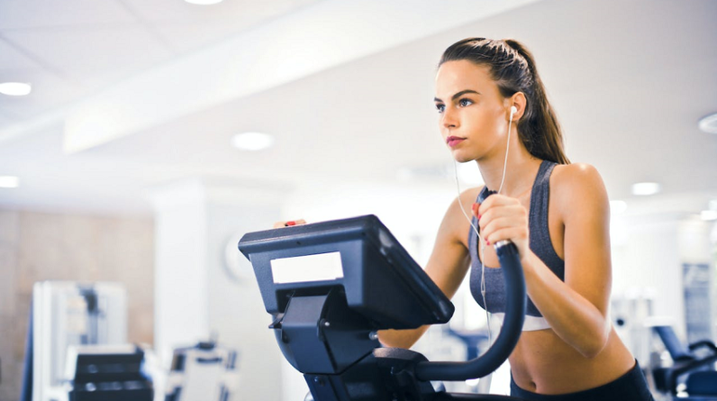 woman on treadmill looking very motivated