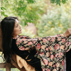 woman enjoying quiet time outside in garden