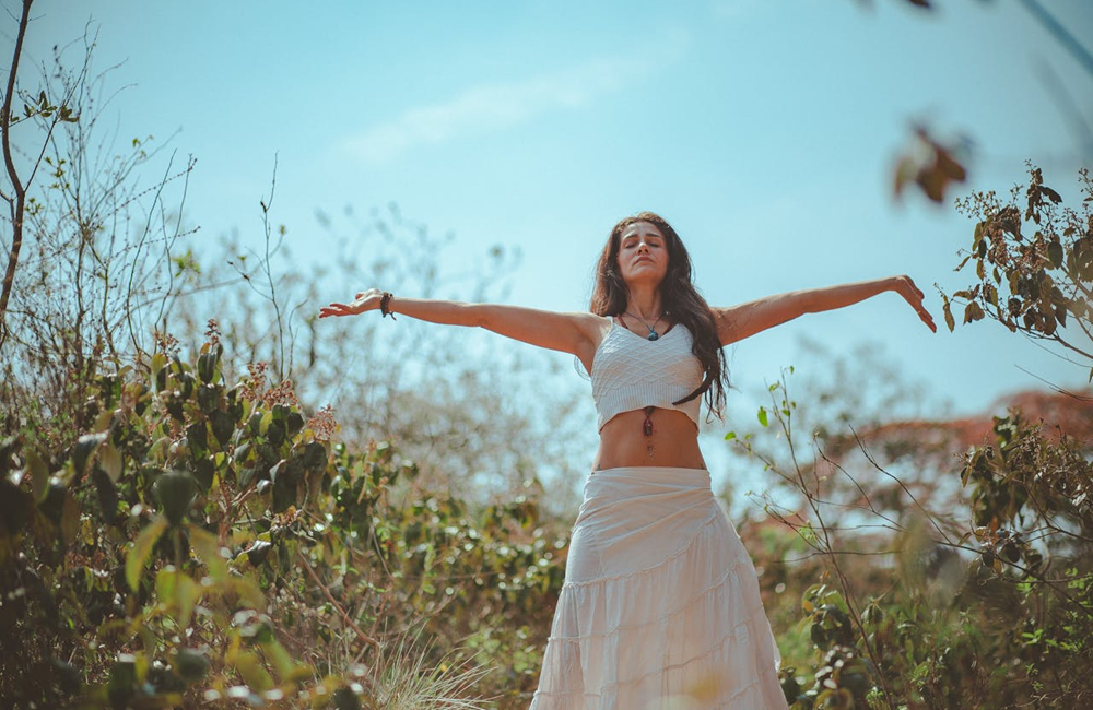 woman outside in nature enjoying solitude