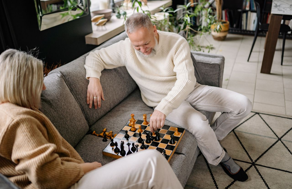 senior couple playing chess